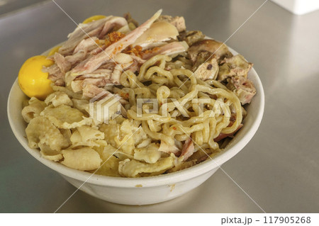 A bowl of Mie Ayam with various toppings. A bowl of Mie Ayam with various toppings. 117905268
