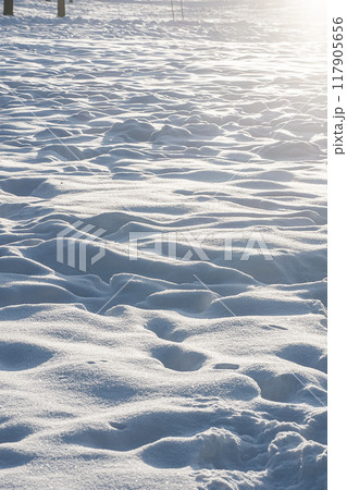 Vertical photo of snow with traces in sunny weather. Vertical photo of snow with traces in sunny weather. 117905656
