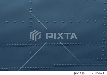 Photo of a metal surface with rivets. 117905671