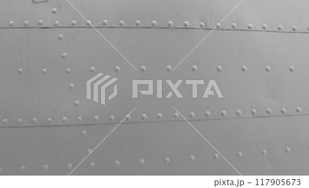Sheet metal with rivets, aircraft fuselage texture. 117905673