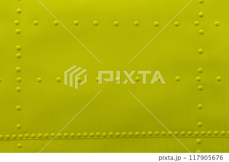Abstract metal background with rivets close-up. 117905676