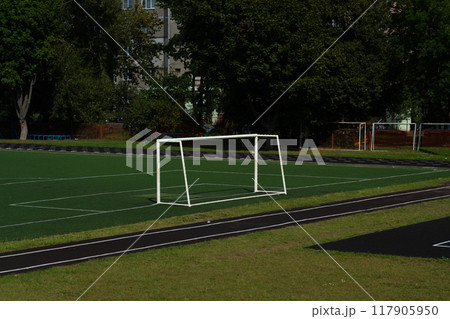 The school stadium. Football goal. The football field is far away 117905950
