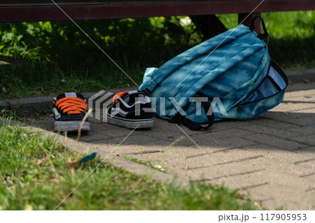 School bag and sneakers of a student, a football player 117905953