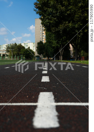A rubber treadmill at the stadium. White markings. Gusty marking line 117905990