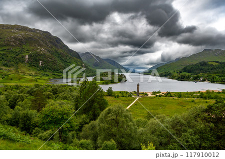 Rural Landscape And Glenfinnan Monument On The Road To The Isles At Lake Loch Shiel In Lochaber In Scotland, UK Rural Landscape And Glenfinnan Monument On The Road To The Isles At Lake Loch Shiel In Lochaber In Scotland, UK 117910012