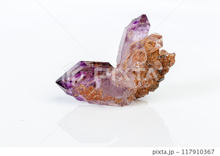 macro mineral stone Amethyst on smoky quartz on a white background 117910367