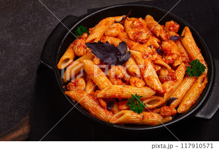 Penne pasta, with shrimp in tomato sauce, close-up, no people, 117910571