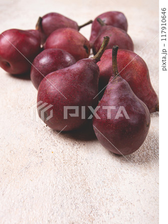 red pears scattered on the table, barletta pear, selective focus, no people, red pears scattered on the table, barletta pear, selective focus, no people, 117910646