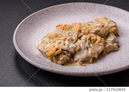 Delicious boiled beef or pork tongue sliced with carrots, onions, sour cream 117910695