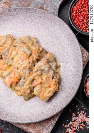 Delicious boiled beef or pork tongue sliced with carrots, onions, sour cream 117910700