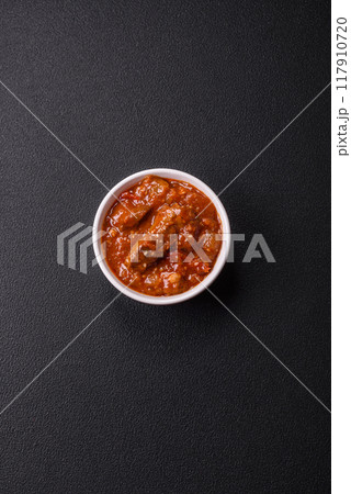Thai Asian dish with meat, hot pepper, tomato sauce and sesame Thai Asian dish with meat, hot pepper, tomato sauce and sesame 117910720