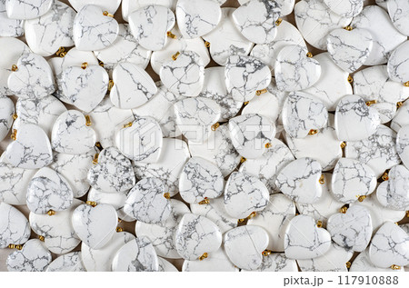 Hearts of Howlite: Striking Display of Marbled White Gemstones Reveals Nature's Artistry for Crystal Enthusiasts and Creators Alike. Hearts of Howlite: Striking Display of Marbled White Gemstones Reveals Nature's Artistry for Crystal Enthusiasts and Creators Alike. 117910888