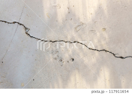 Crack in concrete wall affected with earthquake and collapsed ground Crack in concrete wall affected with earthquake and collapsed ground 117911654