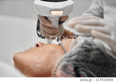 Aesthetic treatment session in a clinic focusing on skin rejuvenation Aesthetic treatment session in a clinic focusing on skin rejuvenation 117914699