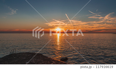 An incredibly beautiful sunset on the beach of the hotel 117916619