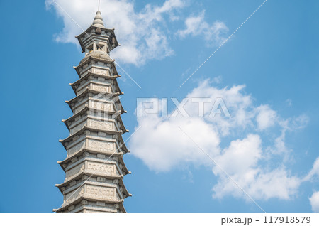Tall Chinese pagoda in Guanyin tang Temple in Dali city, China. Pagodas were originally built to help preserve and protect Buddhist relics and artifacts. 117918579
