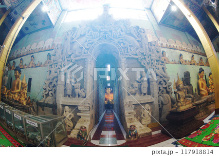 Buddha statue in a tunnel-like balcony with a length of almost 100 meters on each side at Wat Shitetaung Praya. Located at Mrauk-U city in Myanmar. Buddha statue in a tunnel-like balcony with a length of almost 100 meters on each side at Wat Shitetaung Praya. Located at Mrauk-U city in Myanmar. 117918814