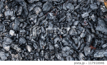 Black charcoal texture from burnt wood. Black charcoal texture from burnt wood. 117918946