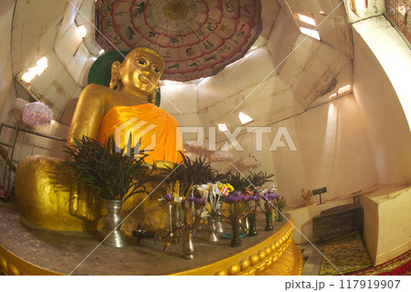 The large main sitting golden buddha in the temple of the Great Vesali image. This is the ancient city of Vesali. the second capital of the Rakhine Kingdom from the 6th-10th Centuries CE. Myanmar. 117919907