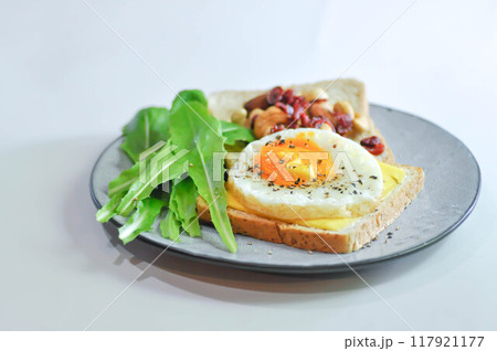 bread with egg and cheese topping or sunny side up egg , lettuce and almond with dried cranberry bread with egg and cheese topping or sunny side up egg , lettuce and almond with dried cranberry 117921177