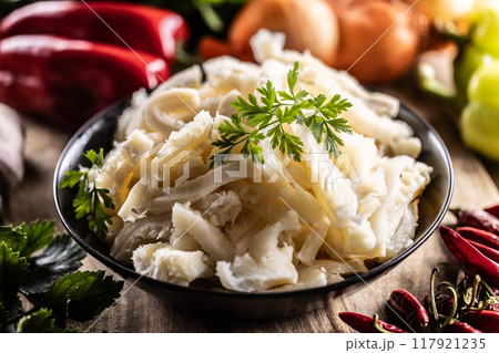 Precooked beef tripes in a bowl with vegetables and herbs ready for cooking 117921235