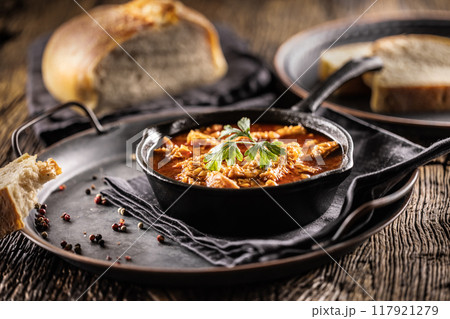 Tasty soup or stew made of beef tripe and spices. Spicy and aromatic tripe soup seasoned with pepper and served with bread. Tasty soup or stew made of beef tripe and spices. Spicy and aromatic tripe soup seasoned with pepper and served with bread. 117921279