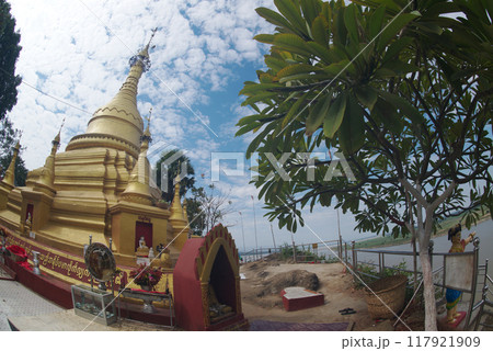 Shwe Myintin Pagoda is located on the top of a Akauk mountain, below which there has a Buddha image carved in sandstone on the cliff along the Ayeyavadee River near Htonbo village, Magway Region. Myan 117921909