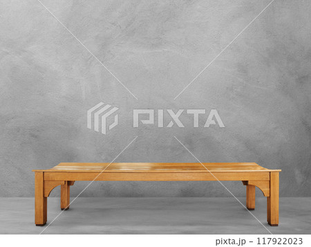 Long wooden chair in the cement room Long wooden chair in the cement room 117922023