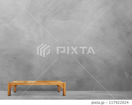 Long wooden chair in the cement room Long wooden chair in the cement room 117922024