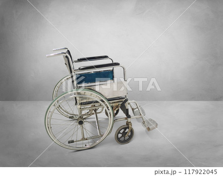 Empty wheelchair in an empty room 117922045