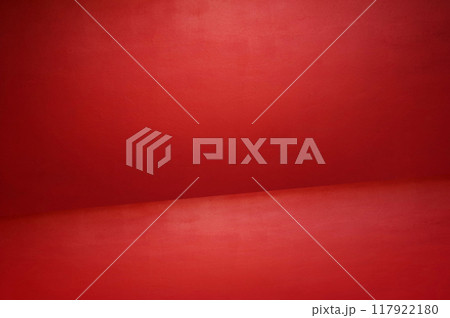 The floor and walls of the room are red as the background. 117922180