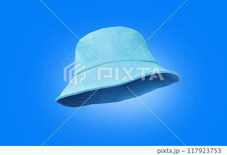 blue bucket hat isolated on a blue background blue bucket hat isolated on a blue background 117923753