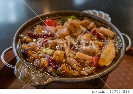 Chicken hot pot, with vegetables in soup. served in the restaurant 117924858