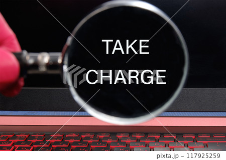 Conceptual take charge symbol. Copy space. TAKE CHARGE words written through a magnifying glass on a black monitor background Conceptual take charge symbol. Copy space. TAKE CHARGE words written through a magnifying glass on a black monitor background 117925259