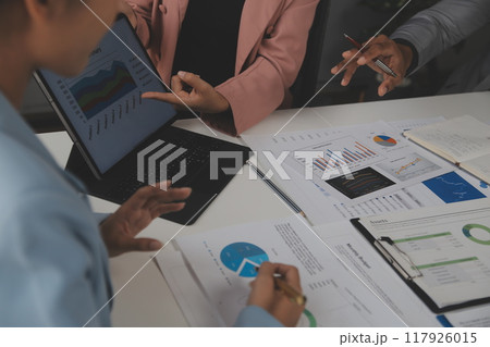 Close up of Business team analyzing income charts and graphs with modern laptop computer. Business analysis and strategy concept. Close up of Business team analyzing income charts and graphs with modern laptop computer. Business analysis and strategy concept. 117926015