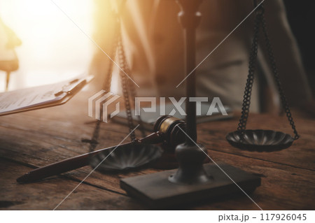 Judge gavel with Justice lawyers having team meeting at law firm background. Concepts of Law and Legal services. Judge gavel with Justice lawyers having team meeting at law firm background. Concepts of Law and Legal services. 117926045