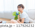 ソファでくつろぐ部屋着の女性/休日の朝/リラックス 117926232