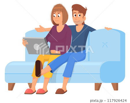 Happy couple on sofa together. People watching laptop 117926424
