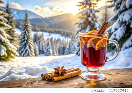 A glass of hot mulled wine with spices, winter landscape 117927412