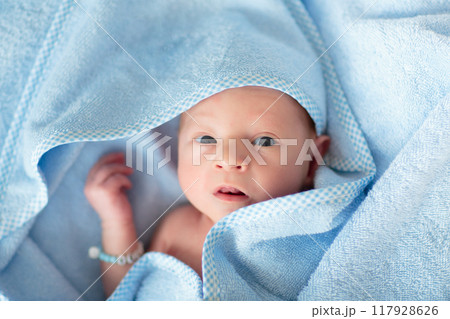 Little baby in blue towel 117928626