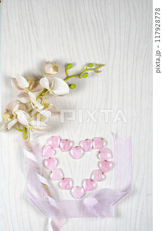 Love in Bloom: Combining Orchids and Rose Quartz for a Dreamy, Wellness-Inspired Flat Lay Perfect for Valentine's Day. Love in Bloom: Combining Orchids and Rose Quartz for a Dreamy, Wellness-Inspired Flat Lay Perfect for Valentine's Day. 117928778