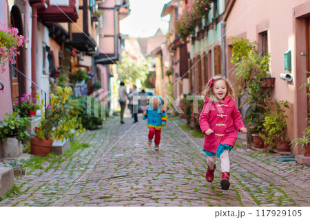 Kids in historical city center in France Kids in historical city center in France 117929105
