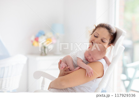 Young mother with newborn baby. Young mother with newborn baby. 117929336