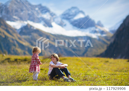 Family with kids hiking in the mountains Family with kids hiking in the mountains 117929906