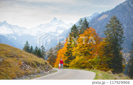 Family with kids hiking in the mountains Family with kids hiking in the mountains 117929908