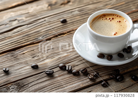 Coffee cup and coffee beans on wooden background. 117930828