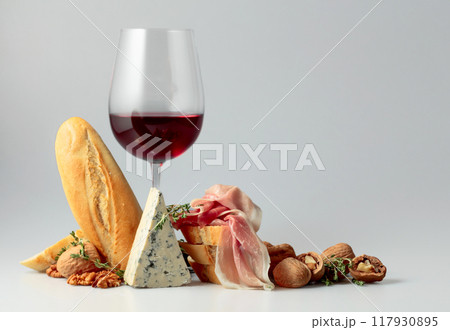 Red wine with traditional Mediterranean snacks. 117930895