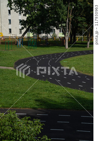 A rubber treadmill at the stadium. White markings. Gusty marking line A rubber treadmill at the stadium. White markings. Gusty marking line 117930963