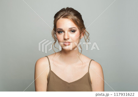 Beauty fashion portrait of elegance woman with fresh skin, updo hair and makeup Beauty fashion portrait of elegance woman with fresh skin, updo hair and makeup 117931622