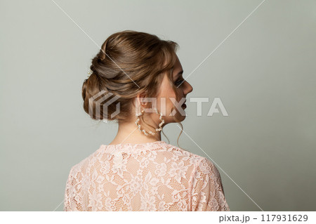 Woman updo hairstyle on white background 117931629